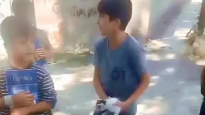 Kuyuda mahsur kalan kediyi çocuklar kurtardı