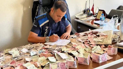 Kağızman'da dilencinin üzerinden poşet dolusu para çıktı